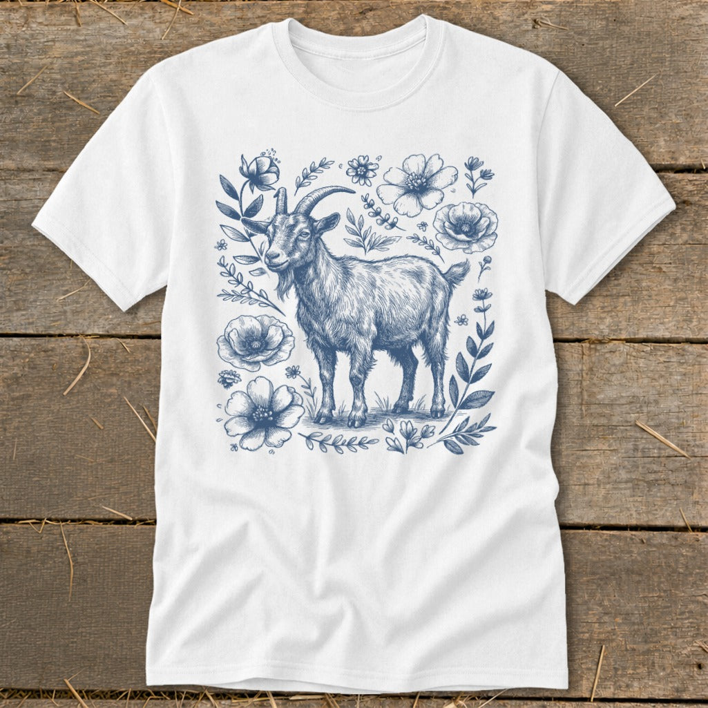 White t-shirt with a blue sketch of a goat surrounded by flowers and leaves.