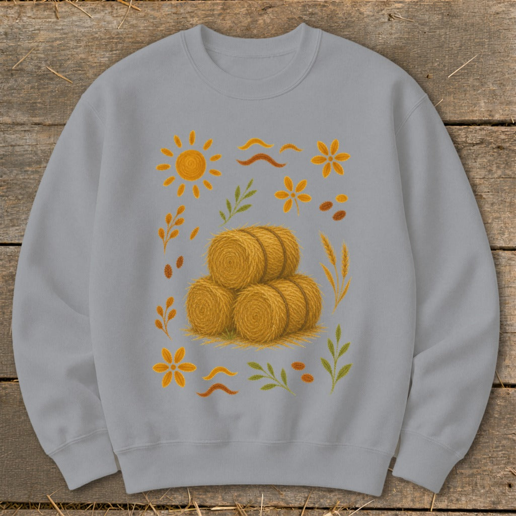 Gray sweatshirt with a fall harvest graphic featuring hay bales and seasonal elements.
