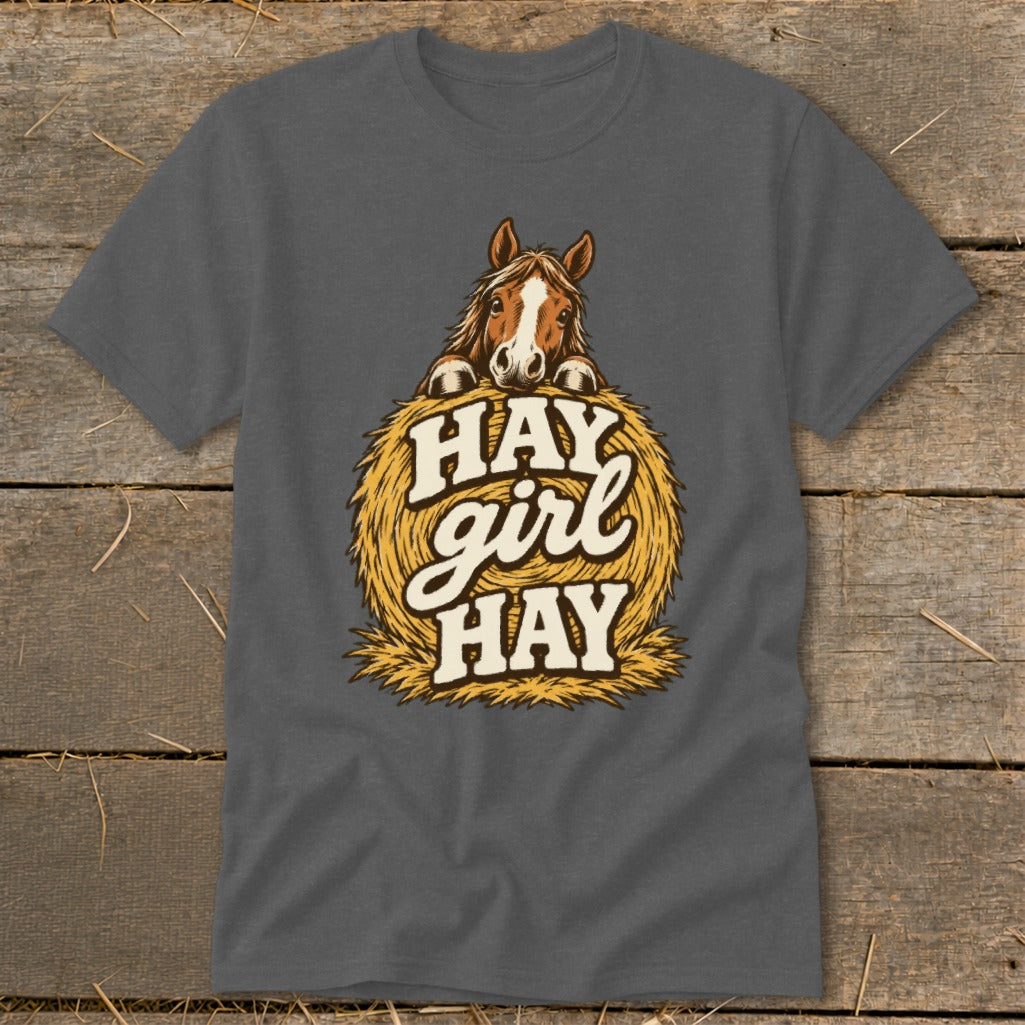 T-shirt graphic of a horse peeking over a hay bale with text "HAY girl HAY".