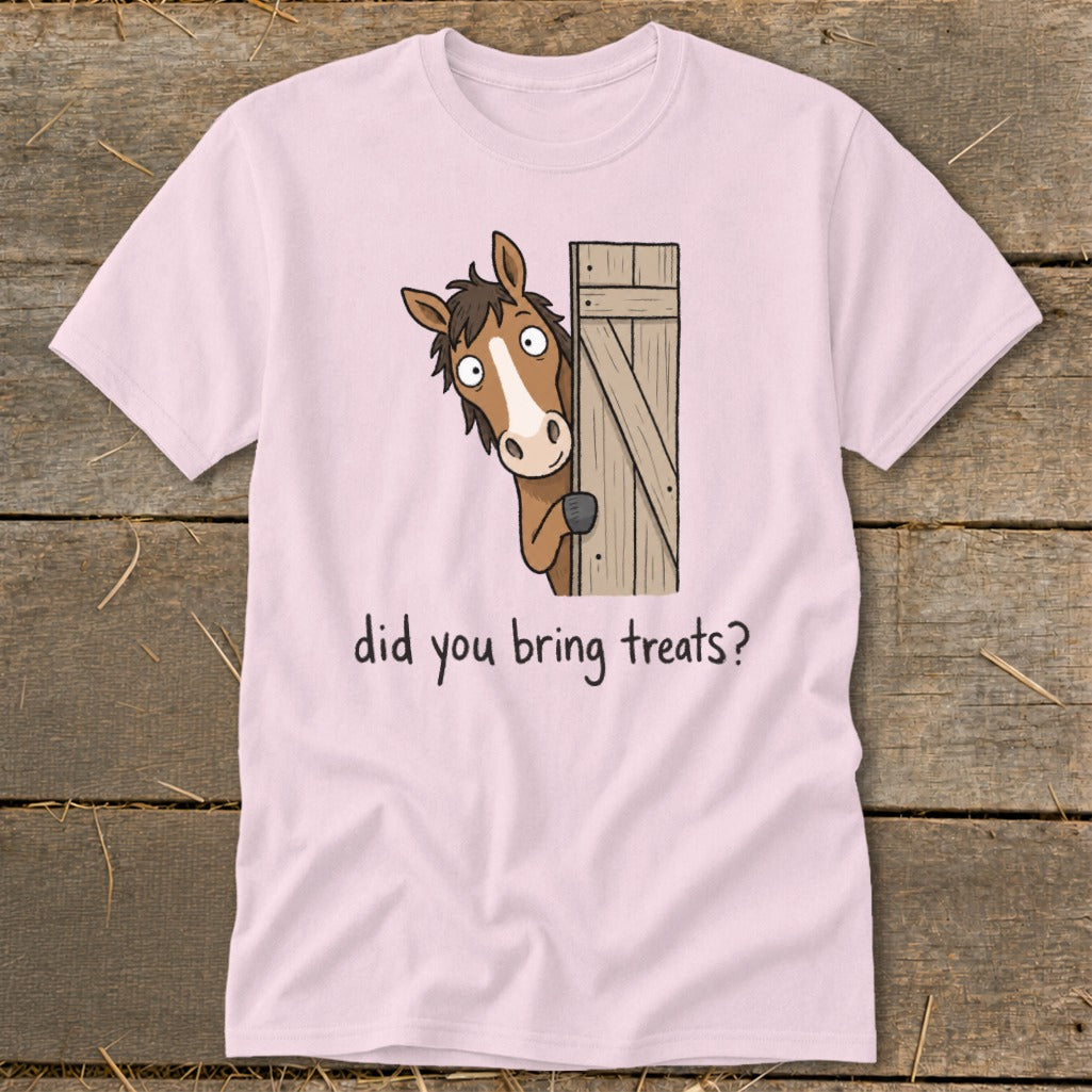 Pink t-shirt with cartoon horse peeking from behind a wooden door asking "did you bring treats?".