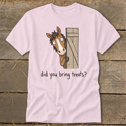 Pink t-shirt with cartoon horse peeking from behind a wooden door asking "did you bring treats?".