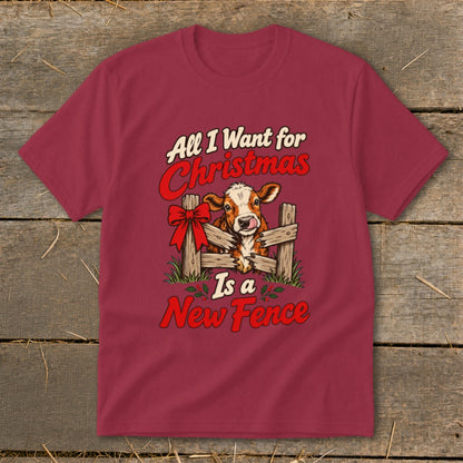 Cow with a red bow peeking over a fence, text reads "All I Want for Christmas Is a New Fence".