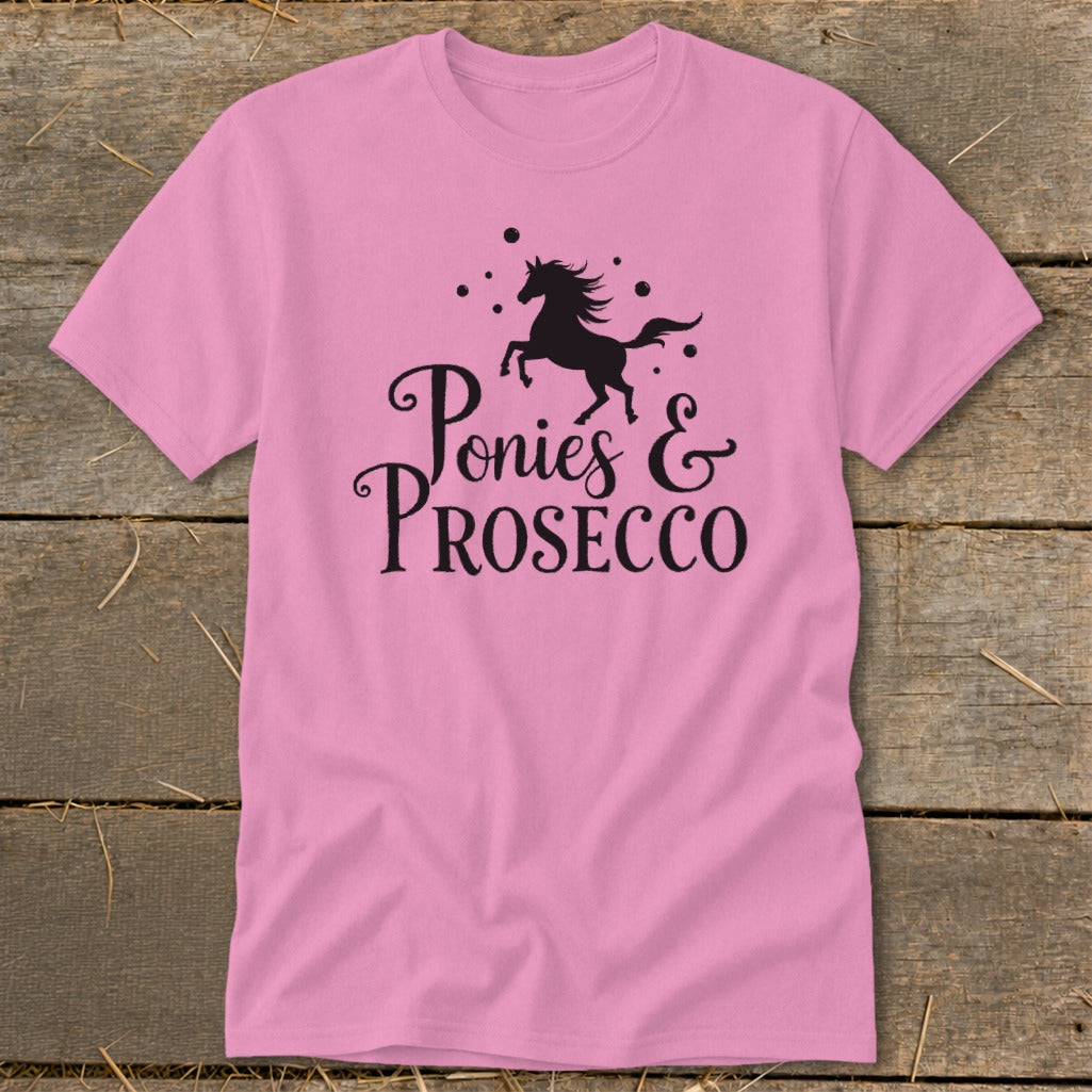 Pink t-shirt with black graphic of a galloping pony and text "Ponies & Prosecco".