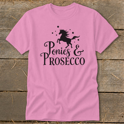 Pink t-shirt with black graphic of a galloping pony and text "Ponies & Prosecco".