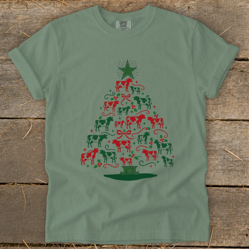 Green t-shirt with Christmas tree made of red and green cows.