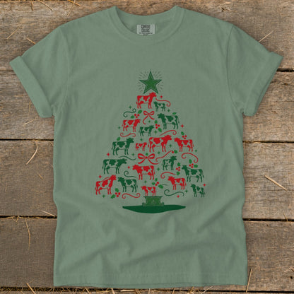 Green t-shirt with Christmas tree made of red and green cows.
