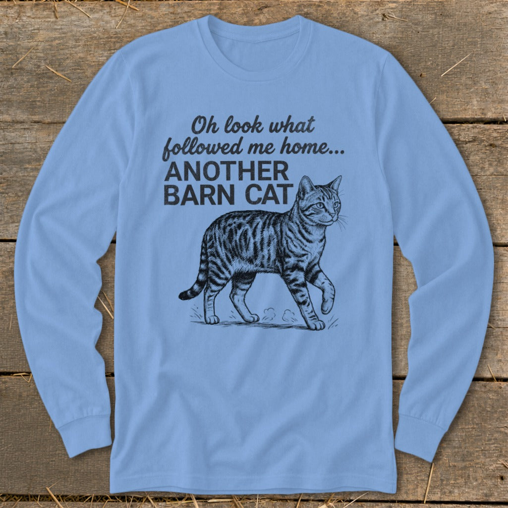 Light blue long-sleeve shirt with a sketch of a tabby cat and text.