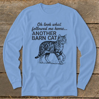Light blue long-sleeve shirt with a sketch of a tabby cat and text.