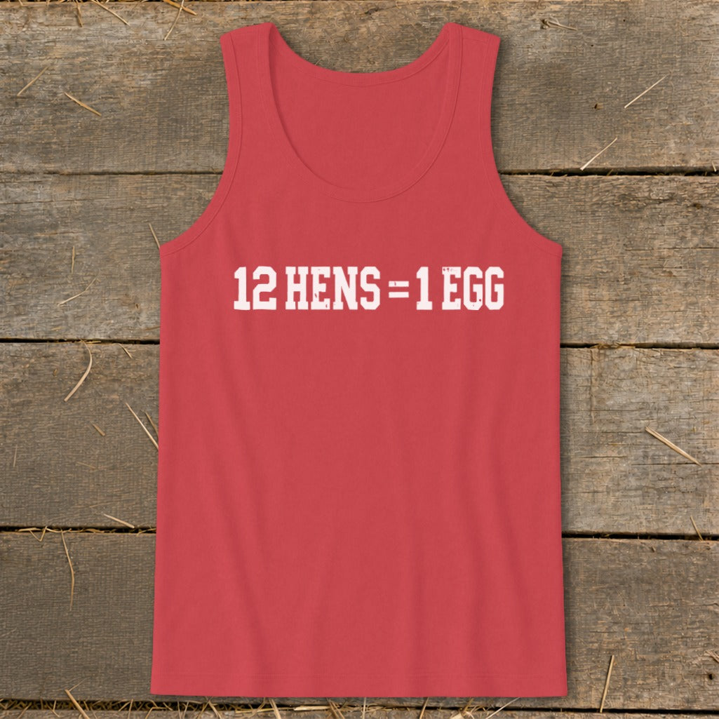 A red tank top printed with the white text 12 HENS = 1 EGG on a rustic wooden background.