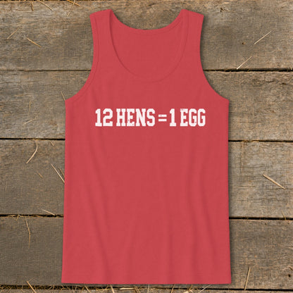 A red tank top printed with the white text 12 HENS = 1 EGG on a rustic wooden background.