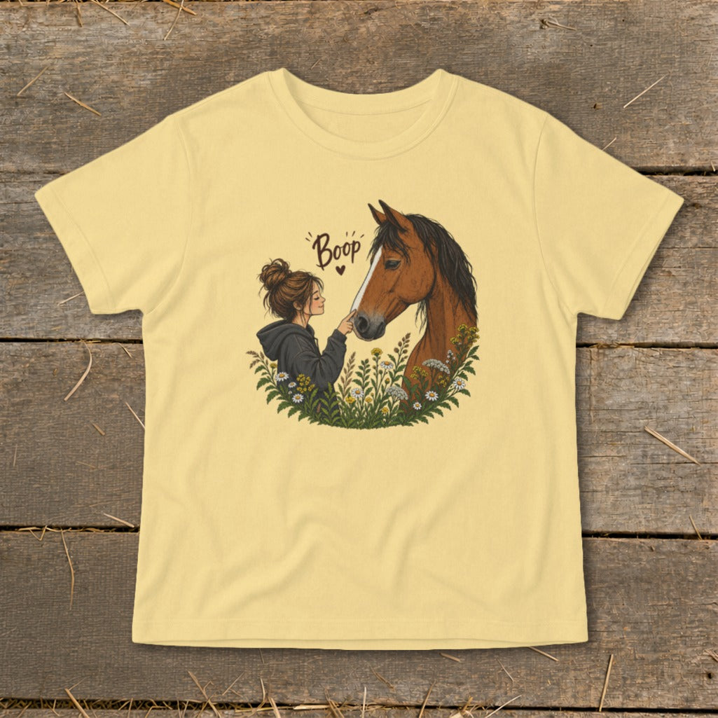 Illustration of a girl booping a horse's nose, with text "Boop" above.