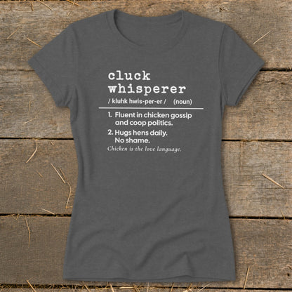Dark grey t-shirt with "Cluck Whisperer" definition printed in white.