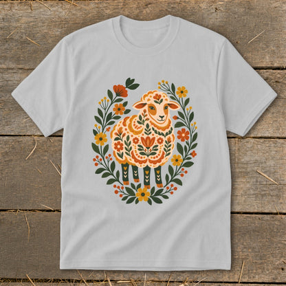 T-shirt with a white sheep design featuring floral patterns and a wreath of flowers.