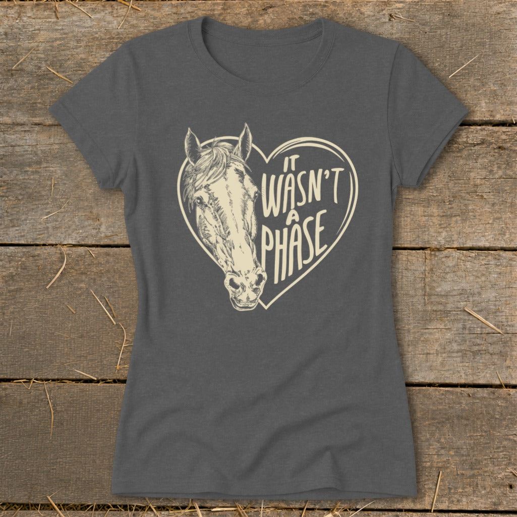 Dark grey t-shirt with a sketched horse's head inside a heart and "it wasn't a phase" text.