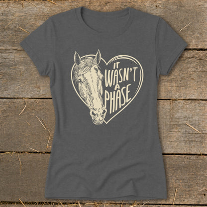 Dark grey t-shirt with a sketched horse's head inside a heart and "it wasn't a phase" text.