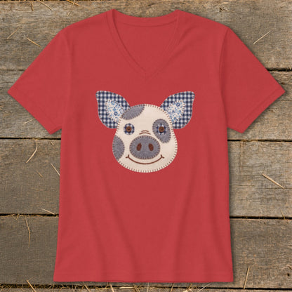 Red v-neck t-shirt with a felt pig face applique featuring gingham ears.