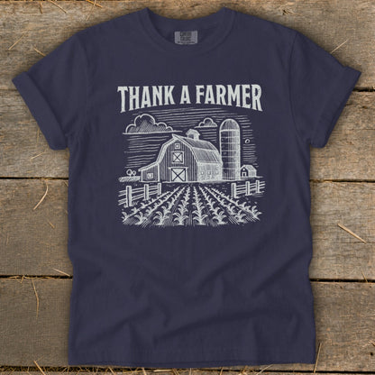 Navy t-shirt with "THANK A FARMER" and a sketch of a farm scene.