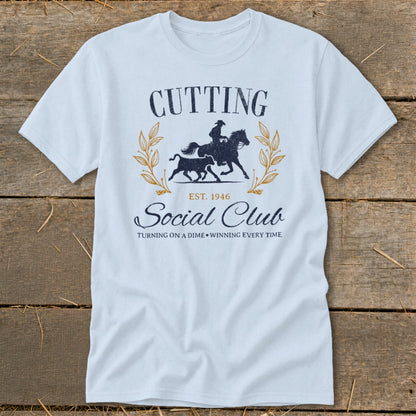 Light blue t-shirt with "Cutting Social Club" graphic and horse and bull imagery.