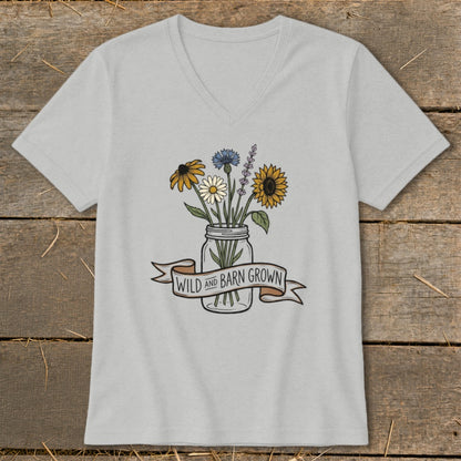 Light gray v-neck t-shirt with a mason jar of wildflowers and "WILD AND BARN GROWN" banner.