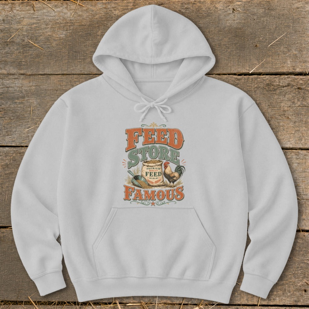 White hoodie with "Feed Store Famous" text and a rooster graphic.