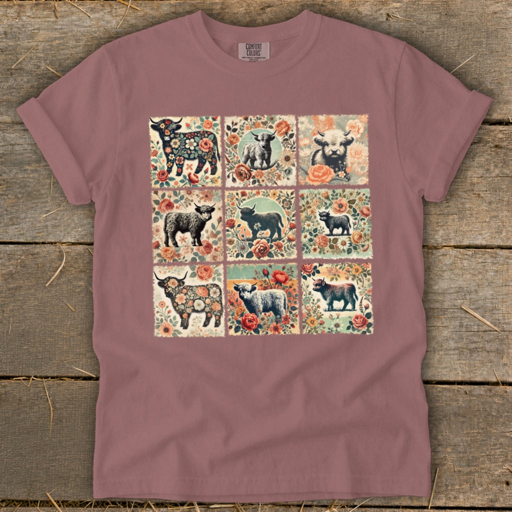 T-shirt with a grid of nine square patches, each featuring highland cows and flowers.