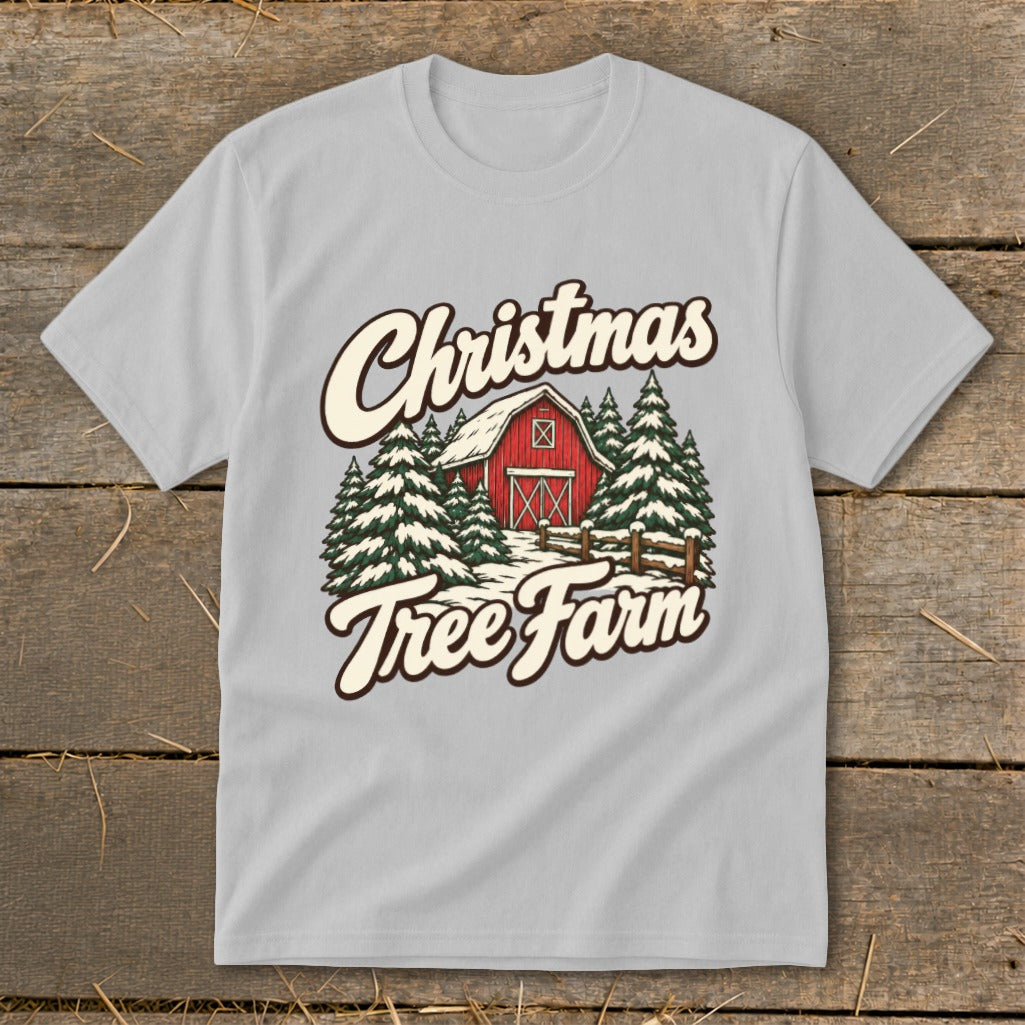 Light gray t-shirt graphic with "Christmas Tree Farm" text, red barn, and snow-covered trees.