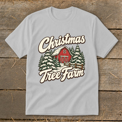 Light gray t-shirt graphic with "Christmas Tree Farm" text, red barn, and snow-covered trees.