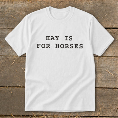 White t-shirt with black text that reads "HAY IS FOR HORSES".