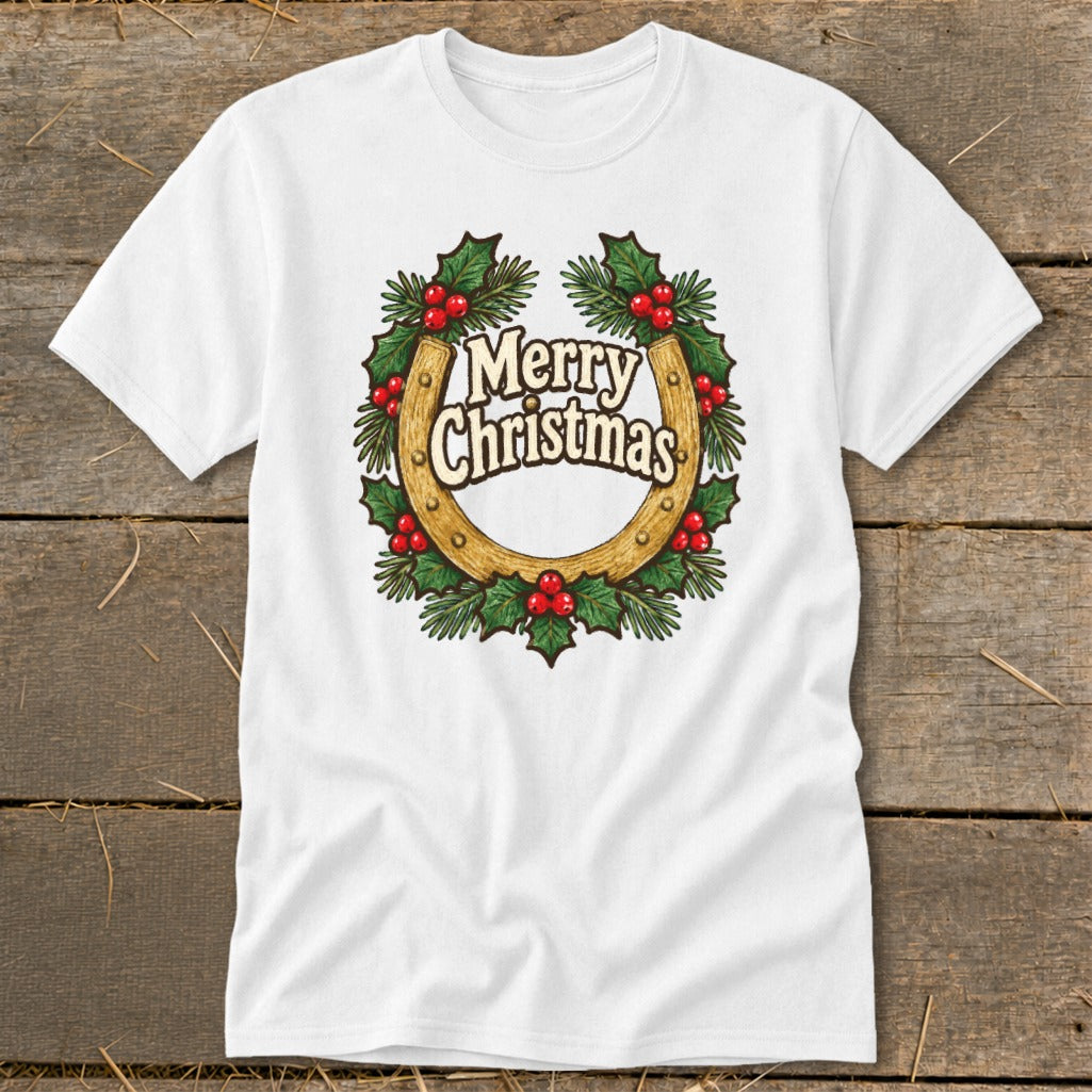 White t-shirt with a gold horseshoe surrounded by a holly wreath and "Merry Christmas" text.