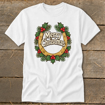 White t-shirt with a gold horseshoe surrounded by a holly wreath and "Merry Christmas" text.