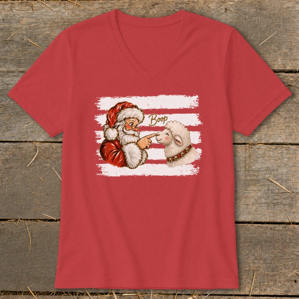 Santa booping a sheep with the word "Boop" on a red t-shirt.