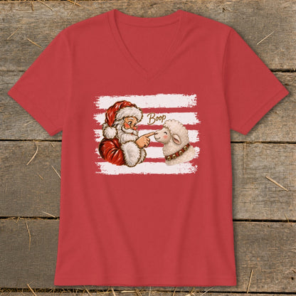 Santa booping a sheep with the word "Boop" on a red t-shirt.