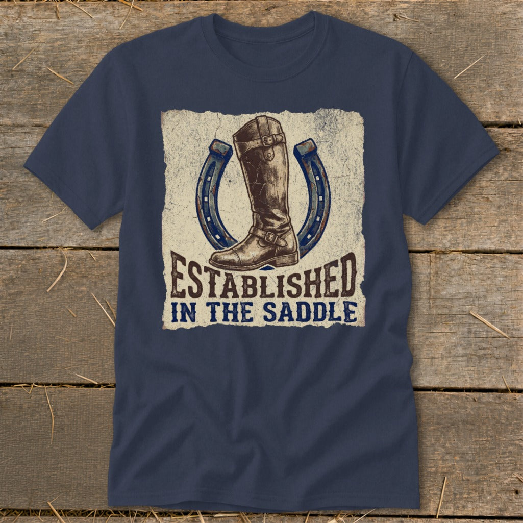 Navy t-shirt with equestrian boot, horseshoes, and "Established In The Saddle" text.