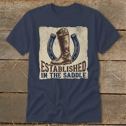 Navy t-shirt with equestrian boot, horseshoes, and "Established In The Saddle" text.