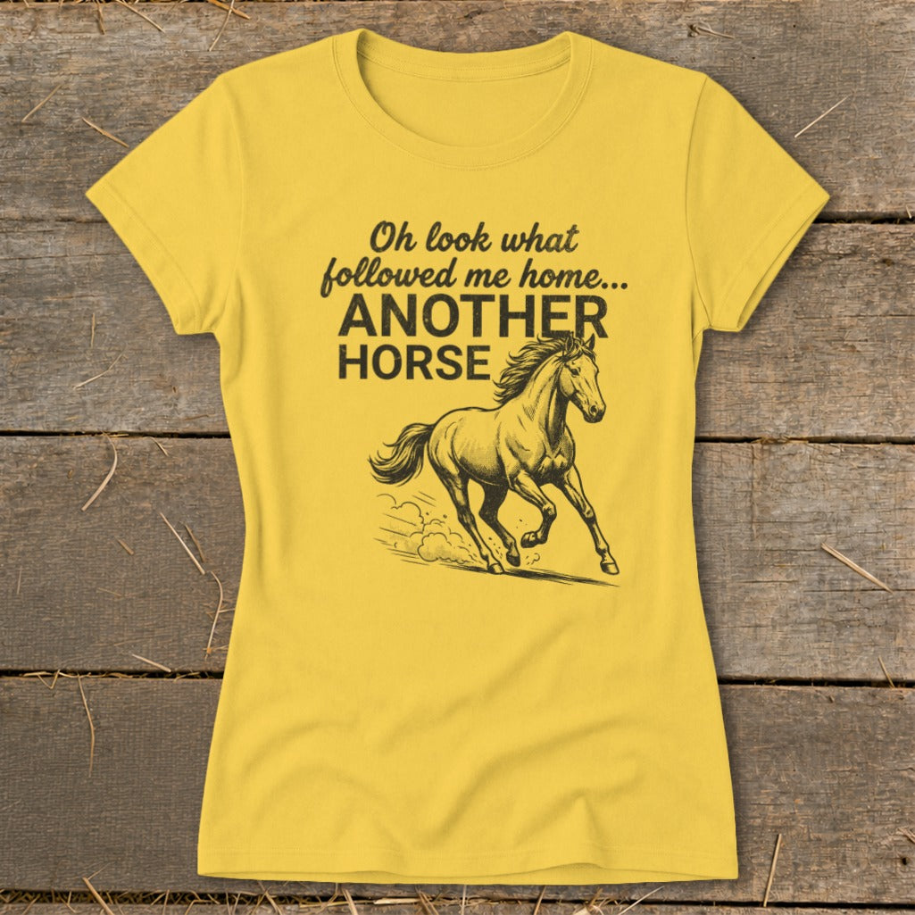 Yellow t-shirt with text "Oh look what followed me home... ANOTHER HORSE" and horse graphic.