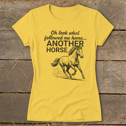 Yellow t-shirt with text "Oh look what followed me home... ANOTHER HORSE" and horse graphic.