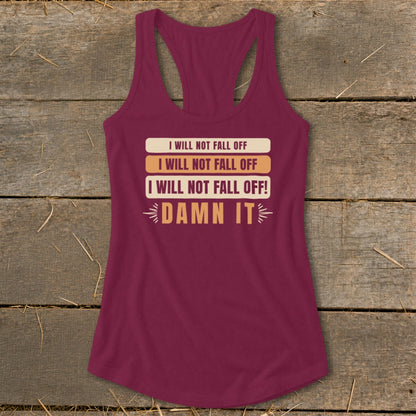 Maroon tank top with text "I Will Not Fall Off" and "Damn It" printed on it.