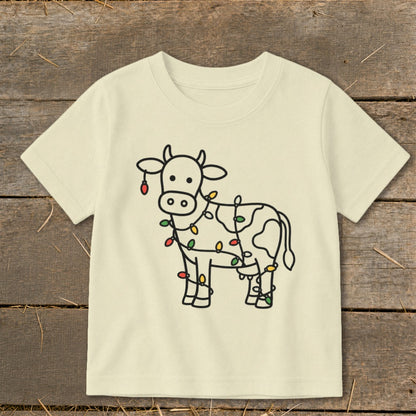 Cream t-shirt with a line drawing of a cow covered in colorful Christmas lights.