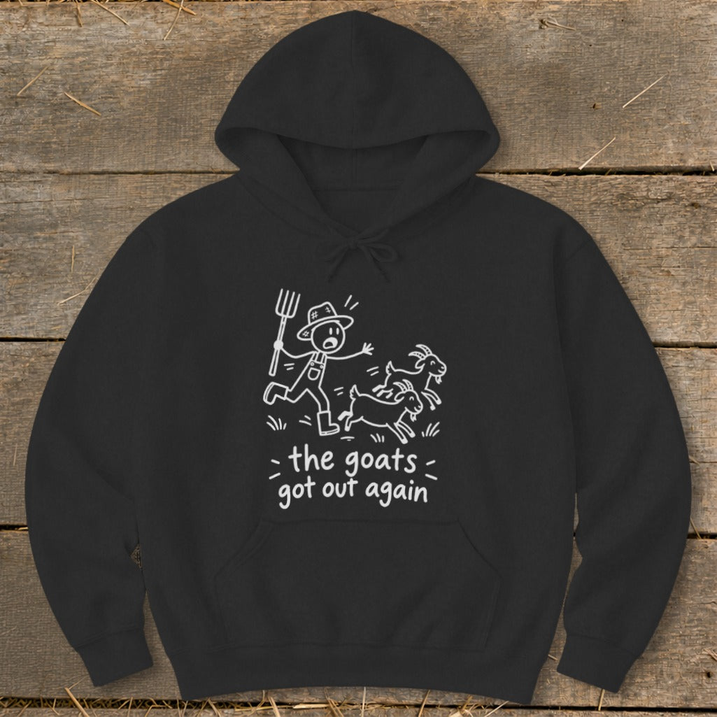 Black hoodie with cartoon farmer chasing goats and text "the goats got out again".