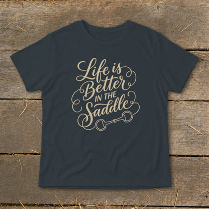 Dark grey t-shirt with beige text "Life is Better in the Saddle" and horse bit graphic.