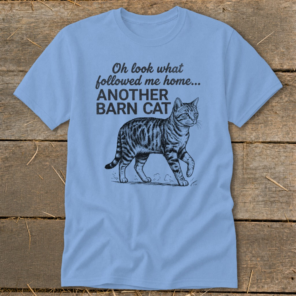 Light blue t-shirt with text and drawing of a tabby cat.