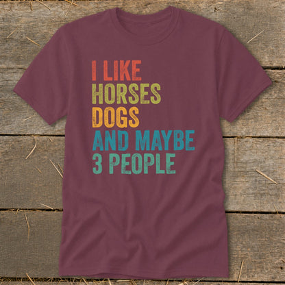 Maroon t-shirt with text "I LIKE HORSES DOGS AND MAYBE 3 PEOPLE".