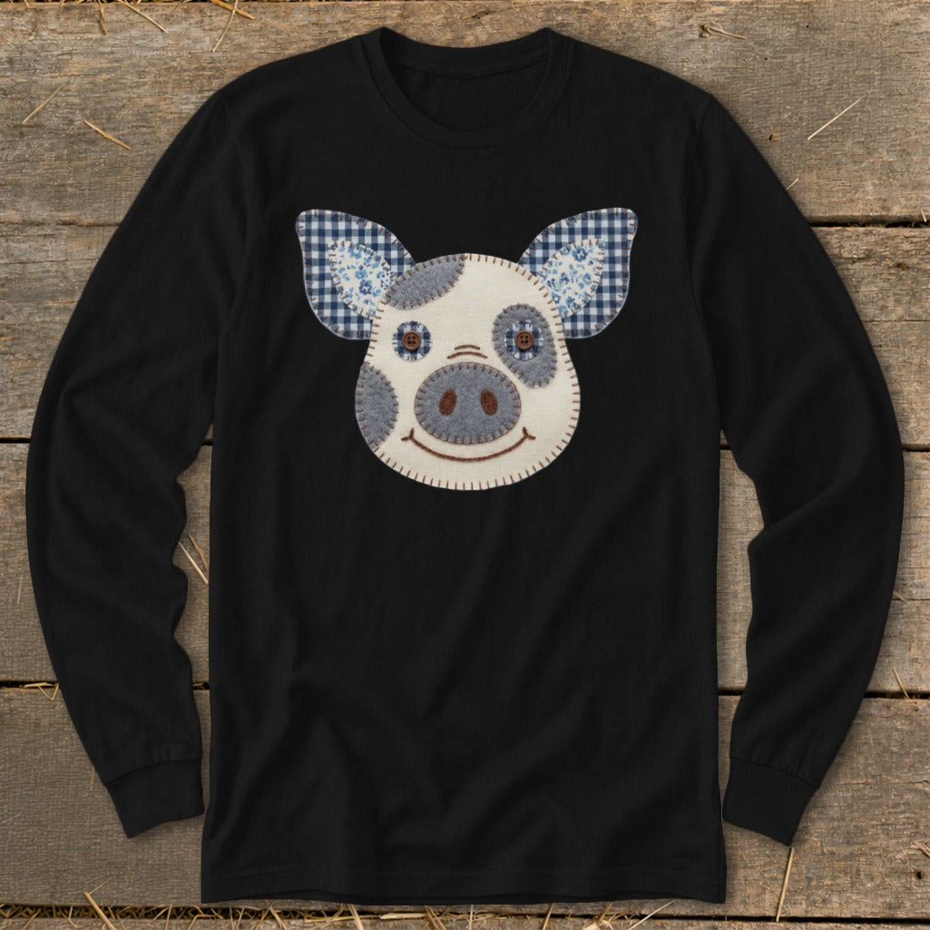 Black long-sleeve shirt with a stitched pig face applique featuring blue gingham ears.