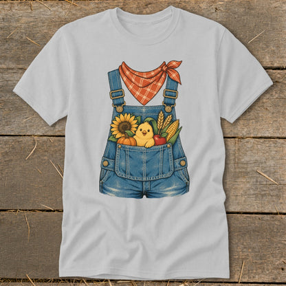 Gray t-shirt with a graphic of denim overalls filled with autumn harvest items and a chick.