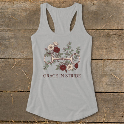 Gray tank top with floral equestrian bit graphic and "GRACE IN STRIDE" text.