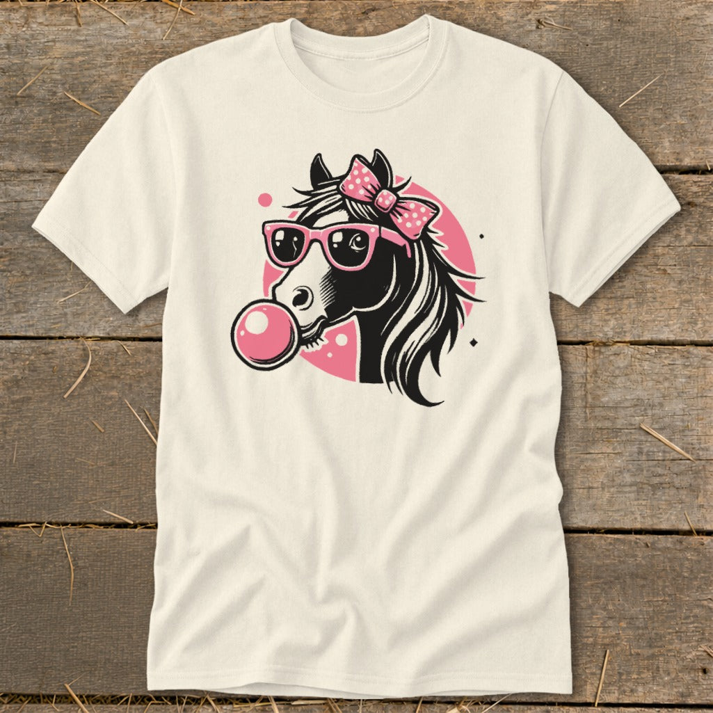 Cream t-shirt with a black horse head wearing pink sunglasses and a bow, blowing bubblegum.
