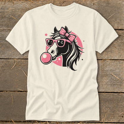 Cream t-shirt with a black horse head wearing pink sunglasses and a bow, blowing bubblegum.