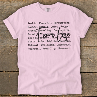 Pink t-shirt with "Farm Life" overlaying descriptive words.