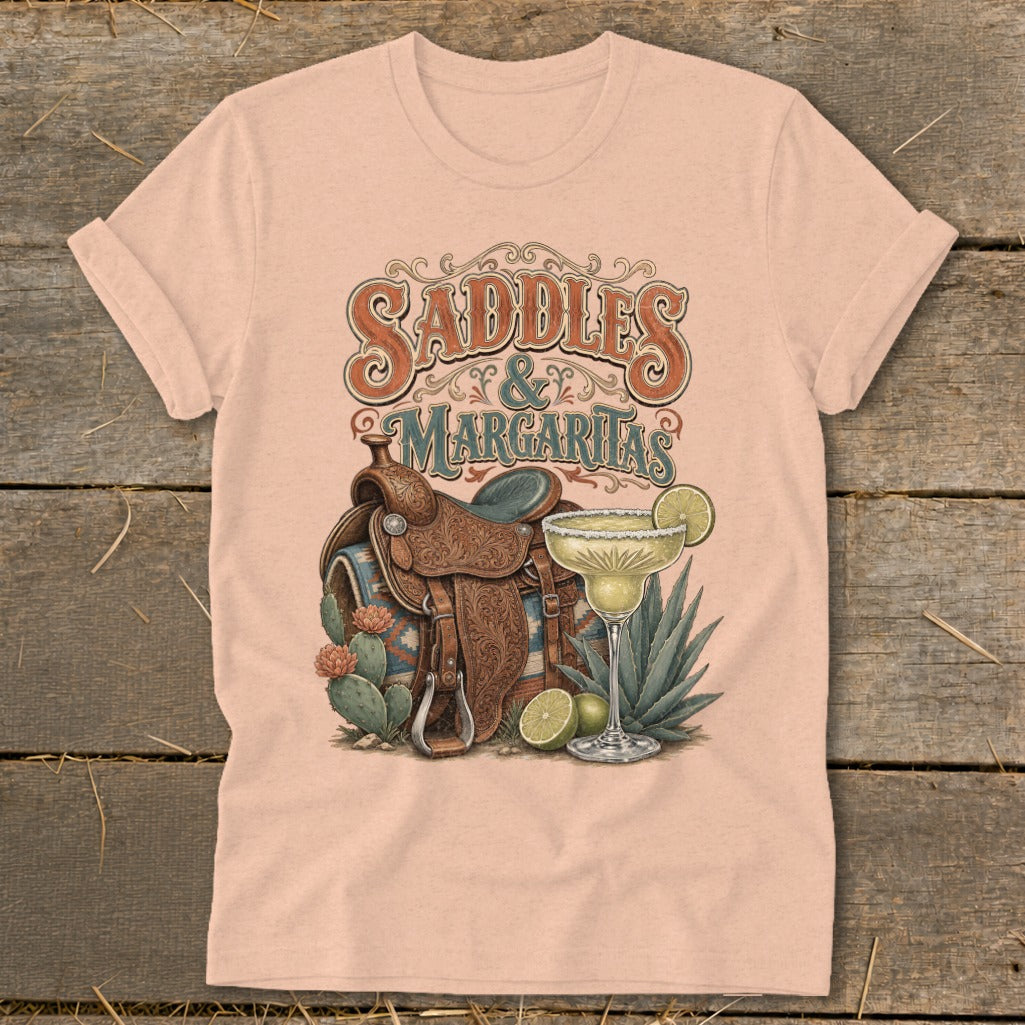 T-shirt graphic with saddles and a margarita, featuring text "SADDLES & MARGARITAS".