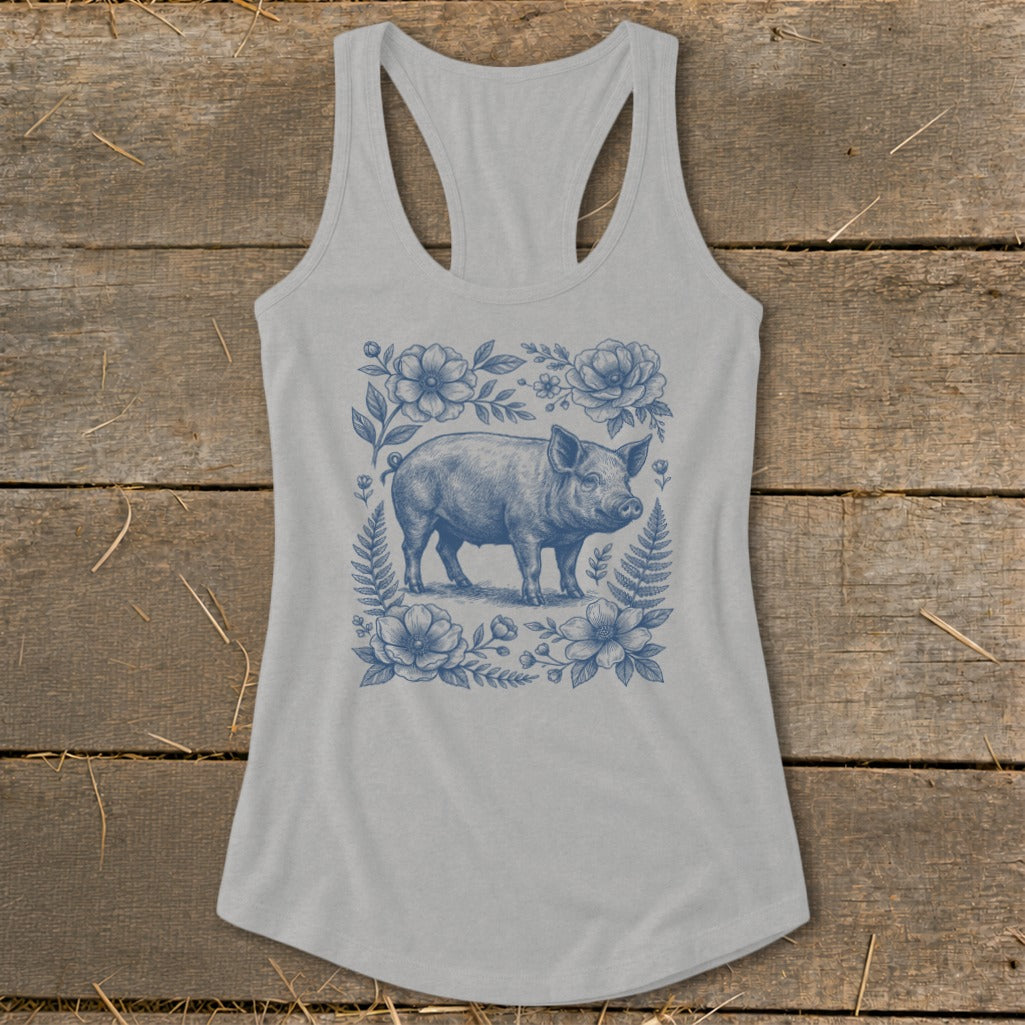 Light gray tank top with blue floral and pig graphic print.